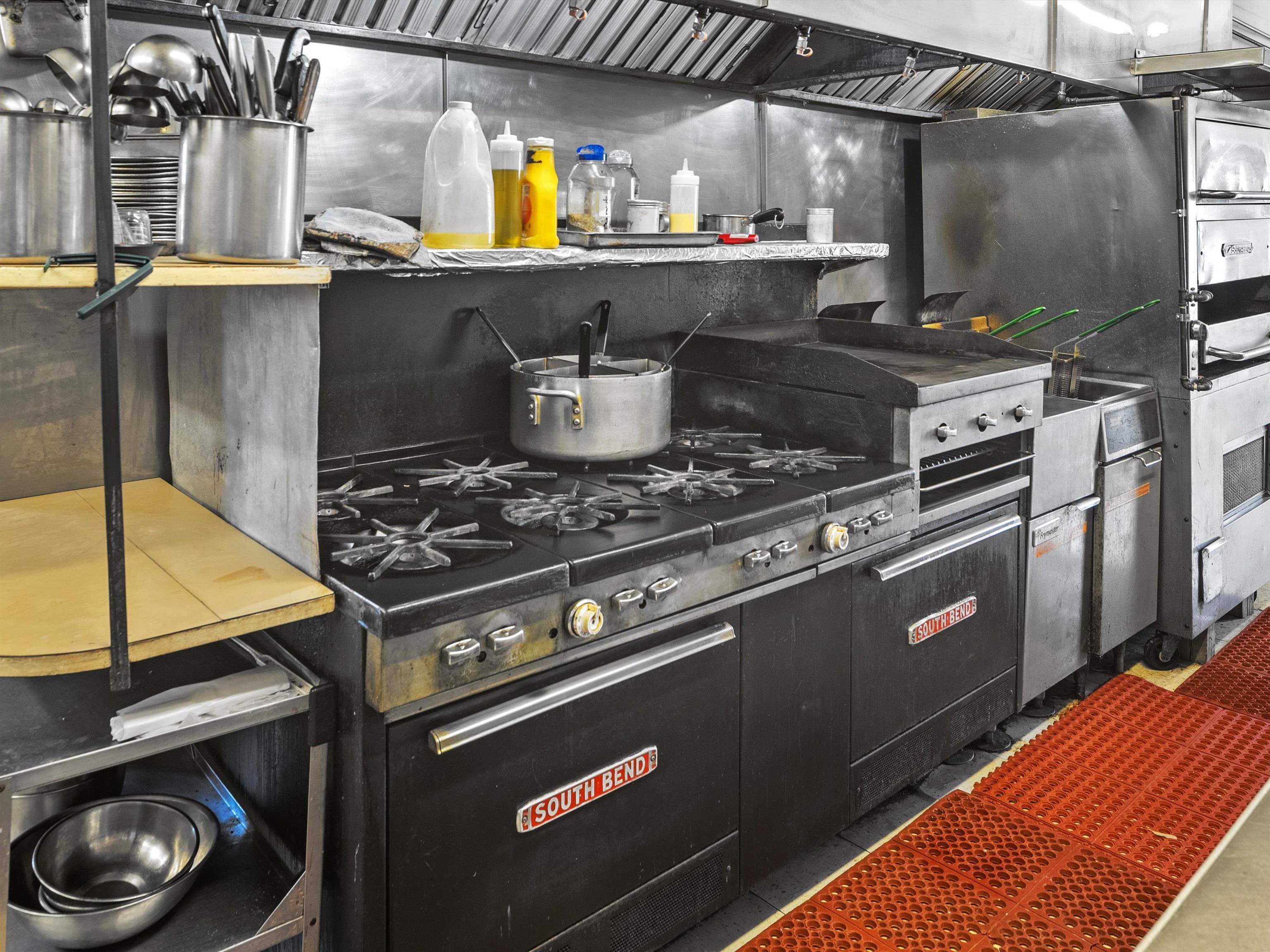 Equipment:  2 ovens, 8 burners, flat top grill, boiler, stand alone & walk in freezers & coolers
