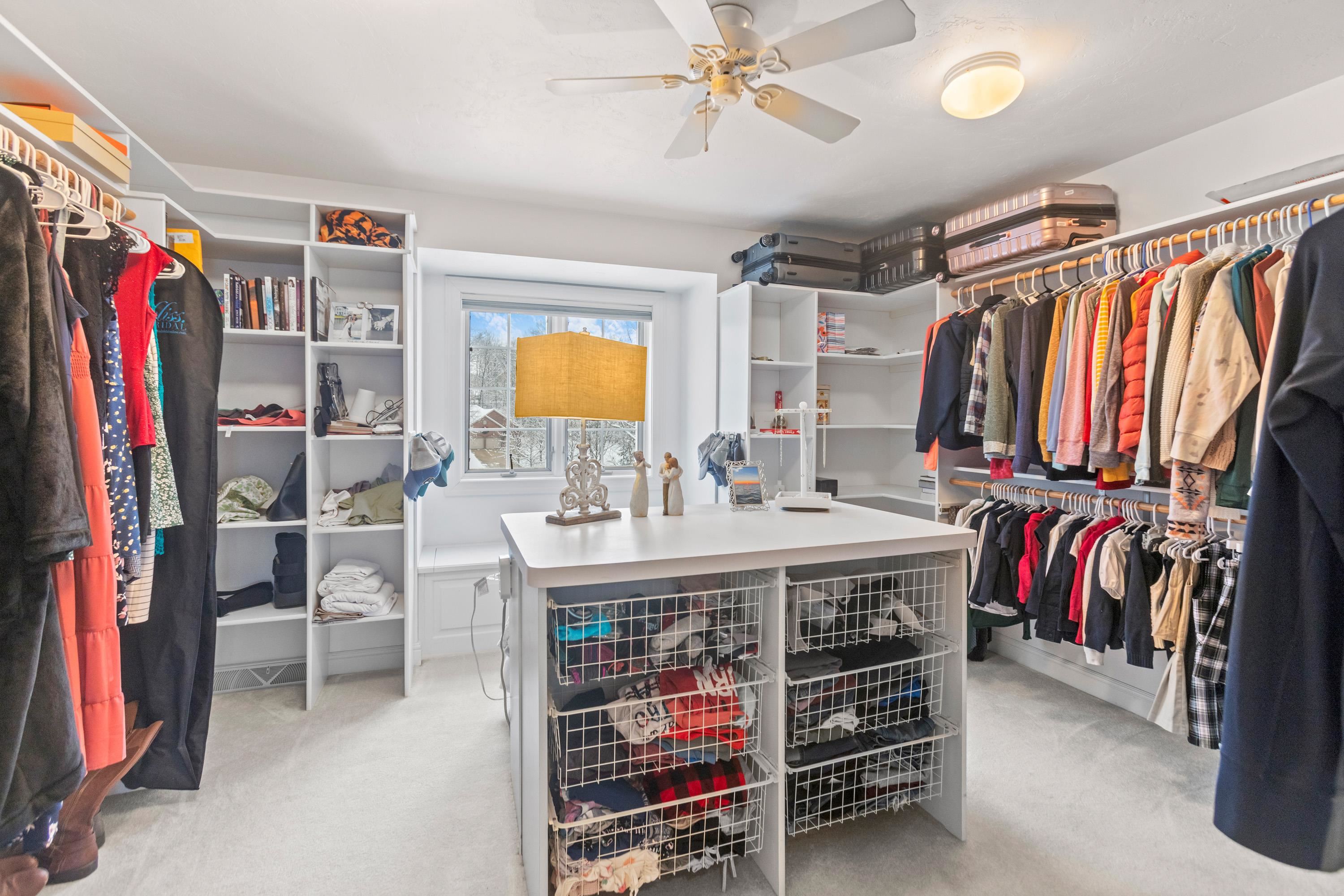 an ENTIRE ROOM for your walk-in closet space in addition to dual closets in primary BR