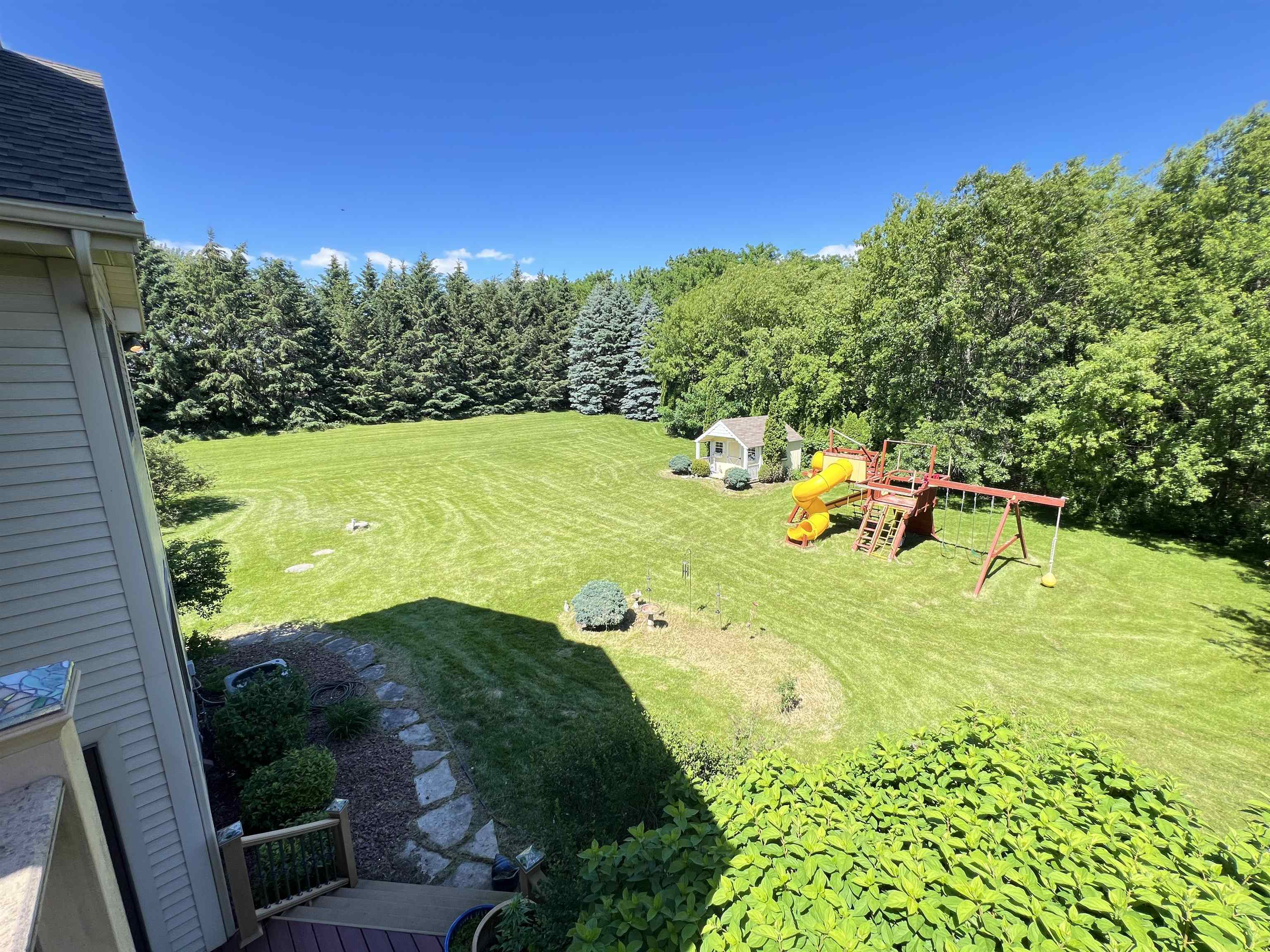 view of back yard from Primary bedroom balcony