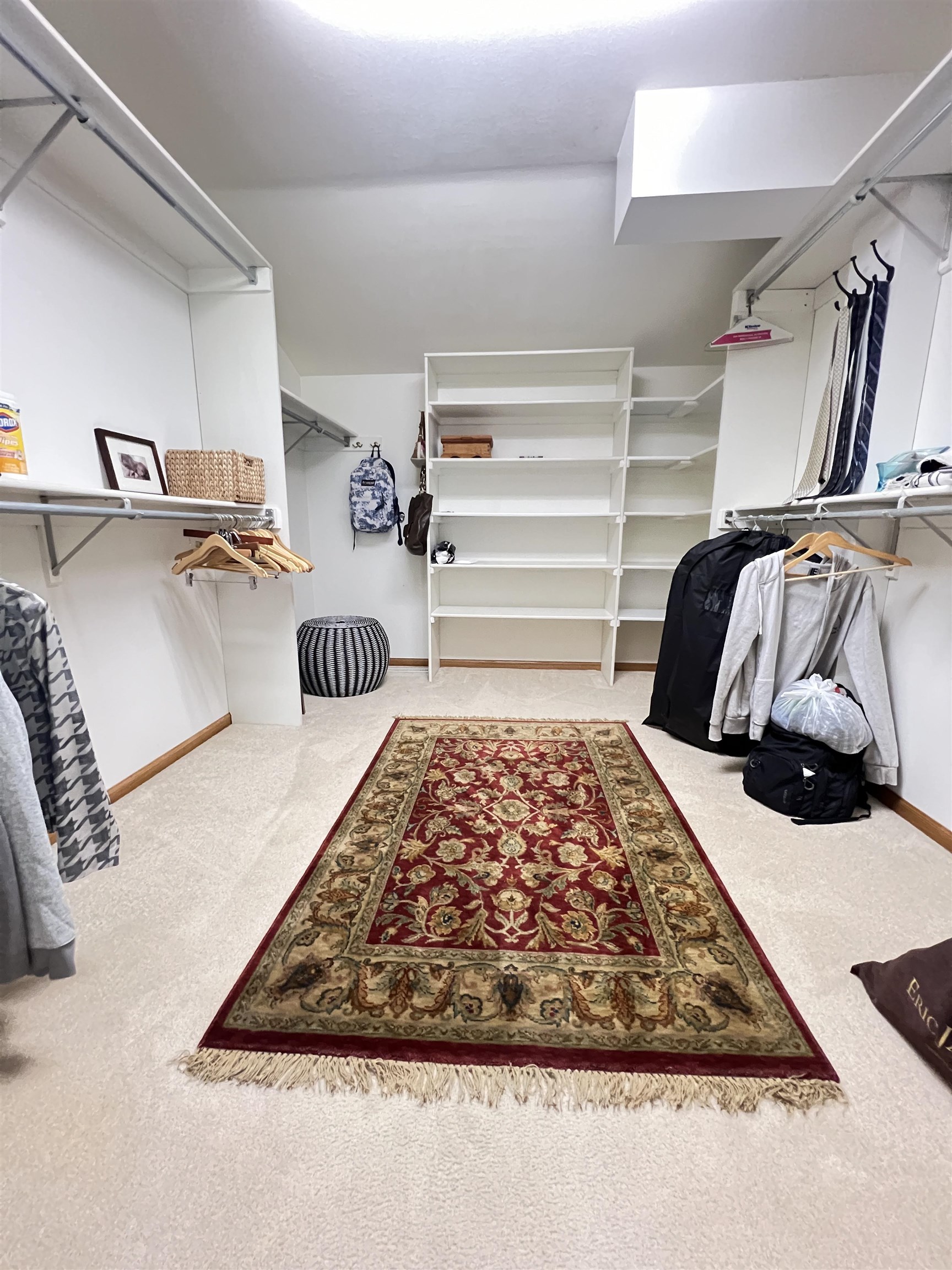 Primary bedroom walk-in closet