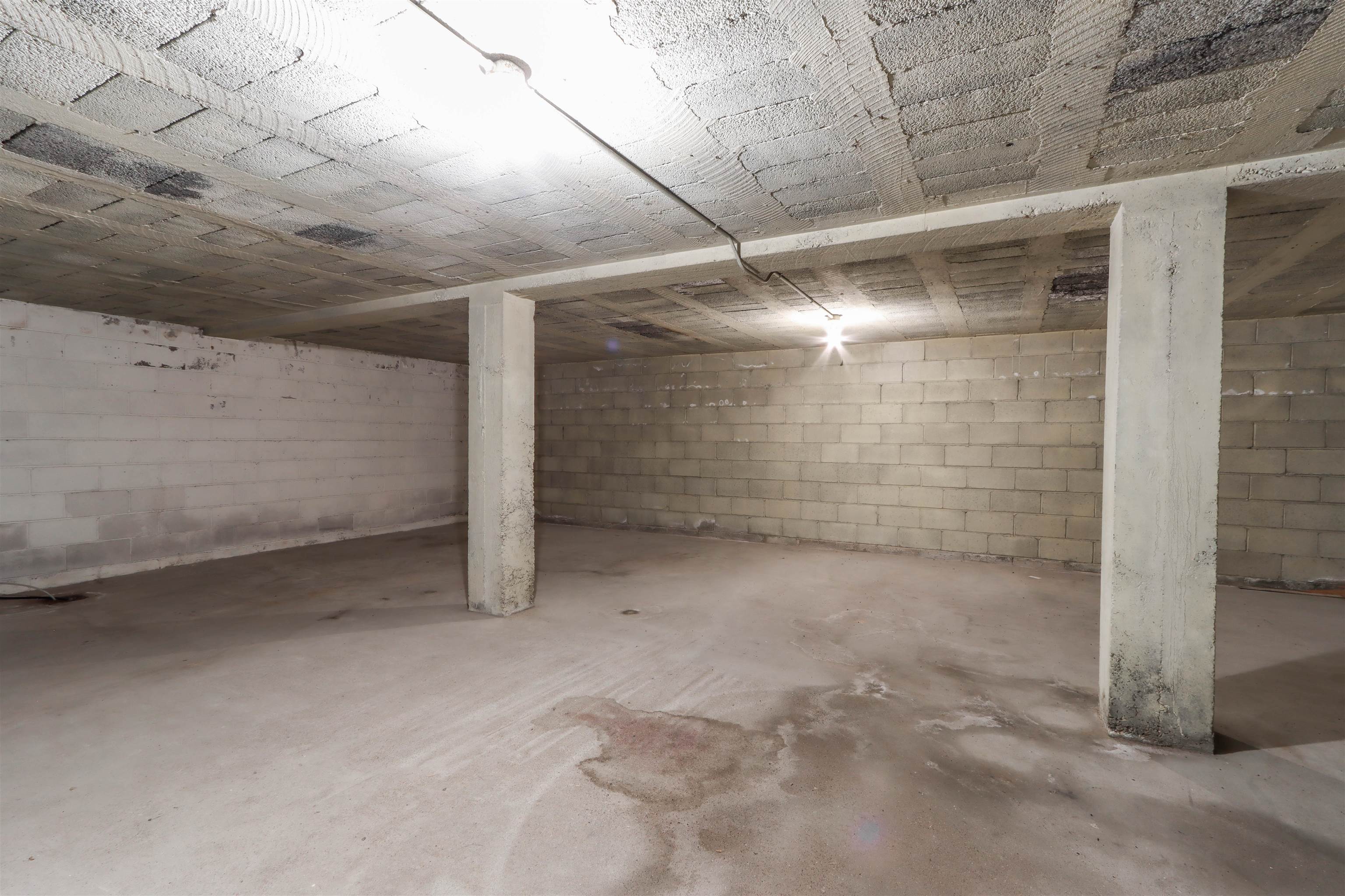 So much storage space! Note the spancrete ceiling. Garage is above