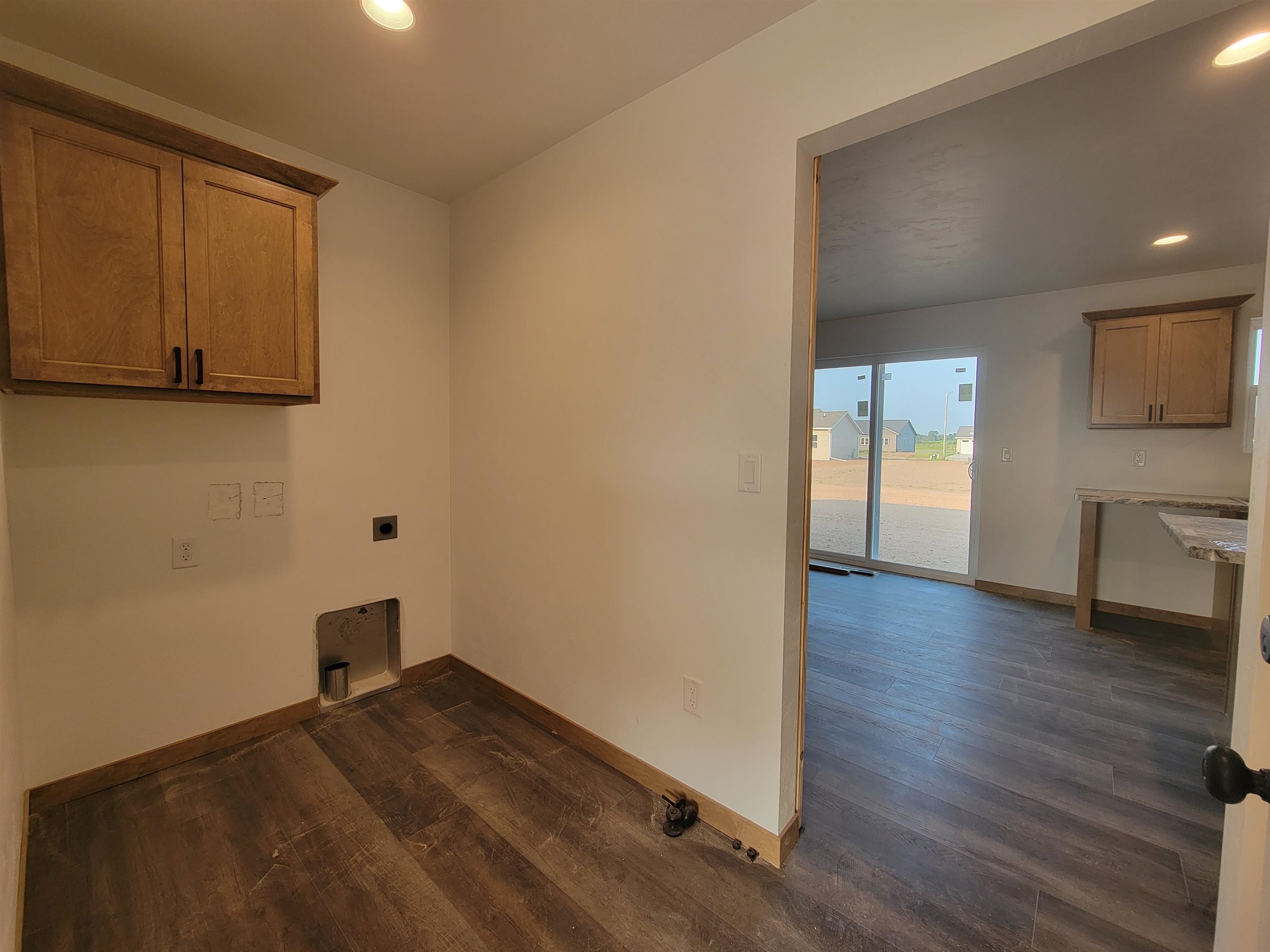 Nice deep mudroom with laundry right off the garage that leads to the kitchen.