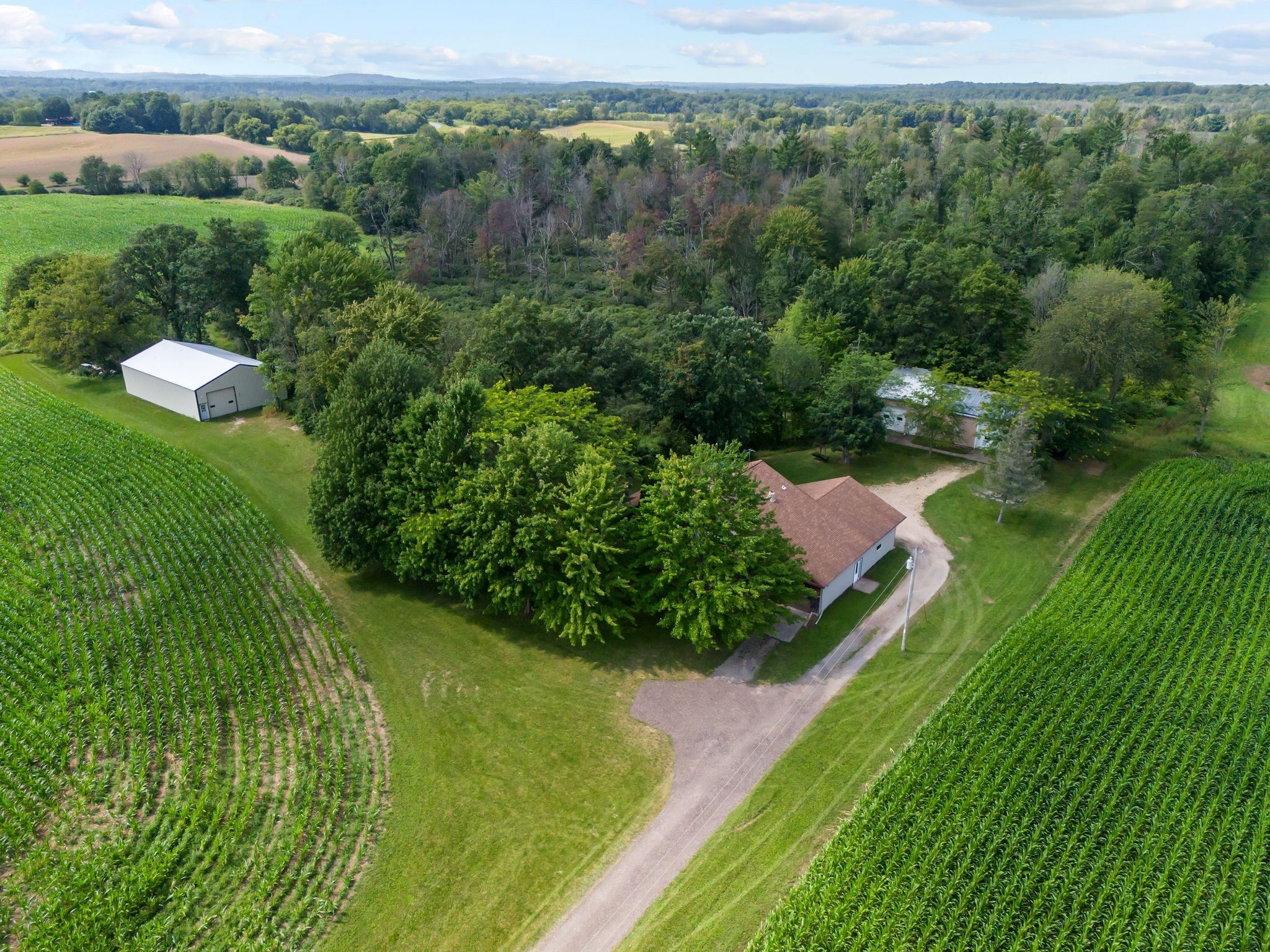 63 acres with home and shops, garages and sheds!