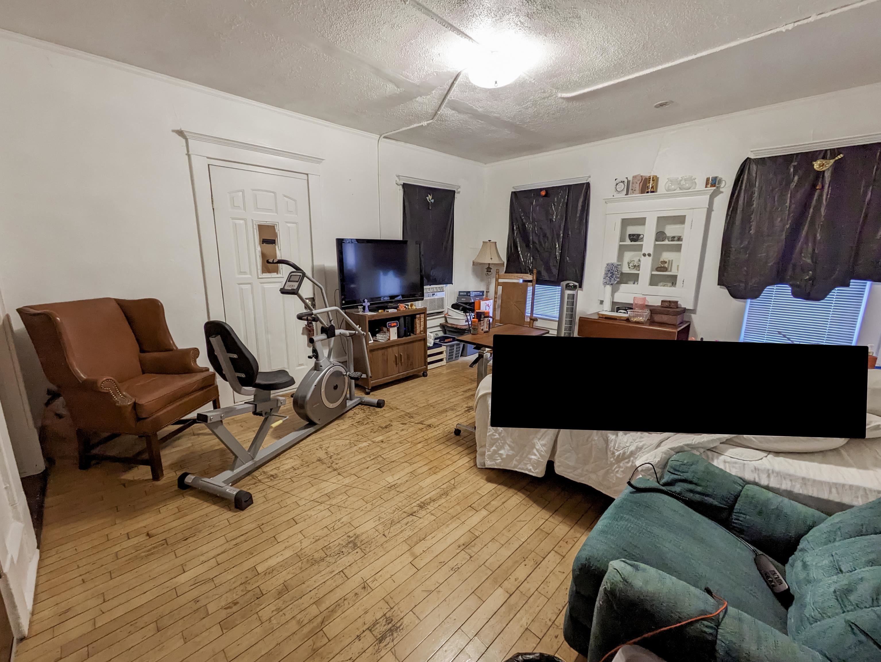 Pacific St Upper Living Room with Covered Porch Above LL Storefront