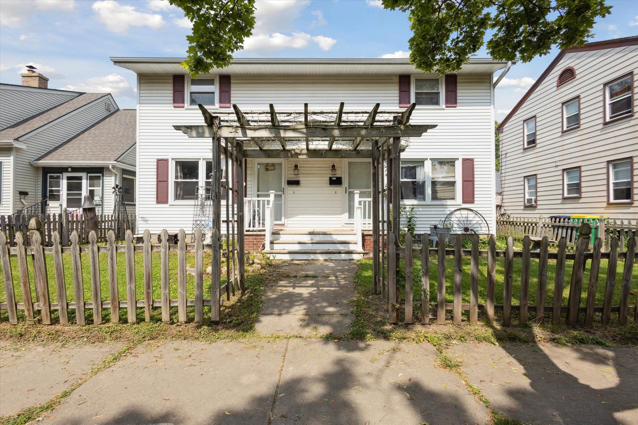 Side by side duplex with rear attached garage.