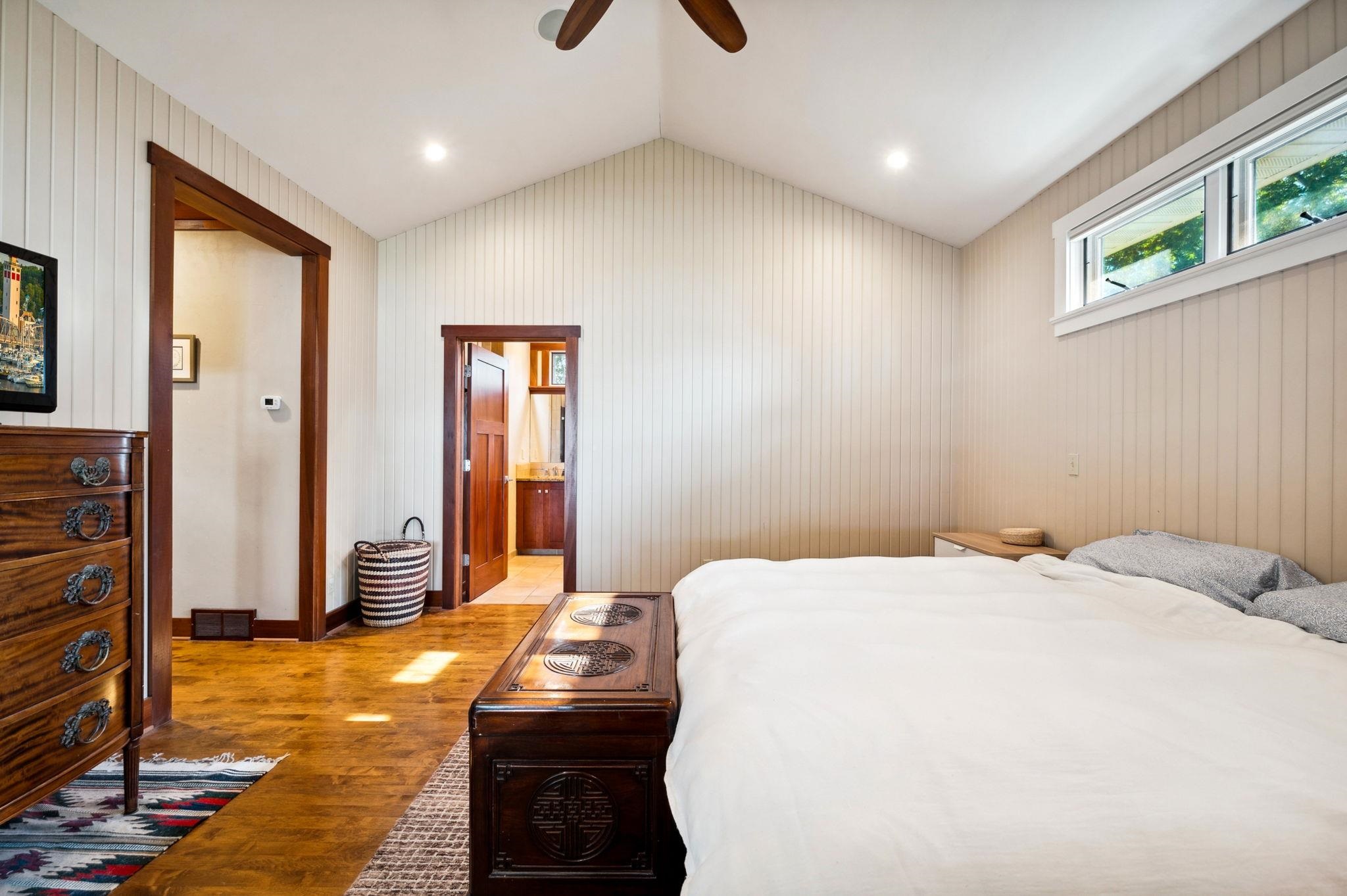 Main floor primary bedroom with ensuite private bath.