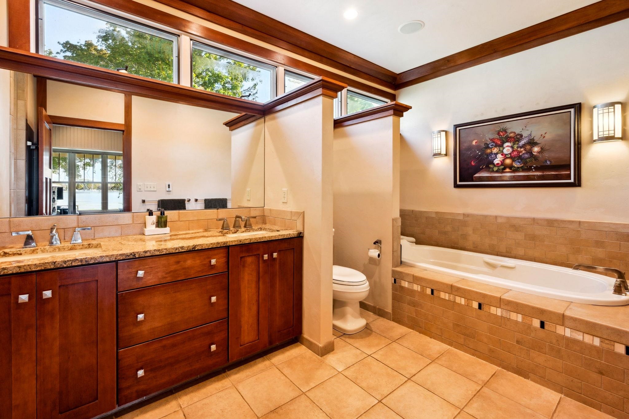 Ensuite primary bath with soaking tub and separate walk in shower.