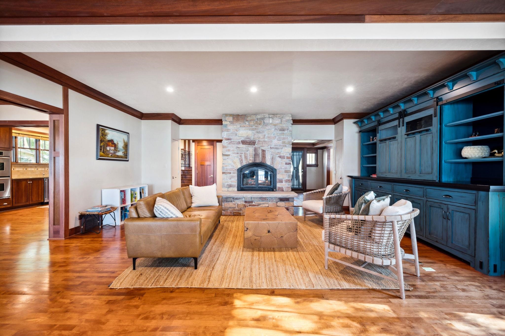 Living Room with wood burning stone fireplace.