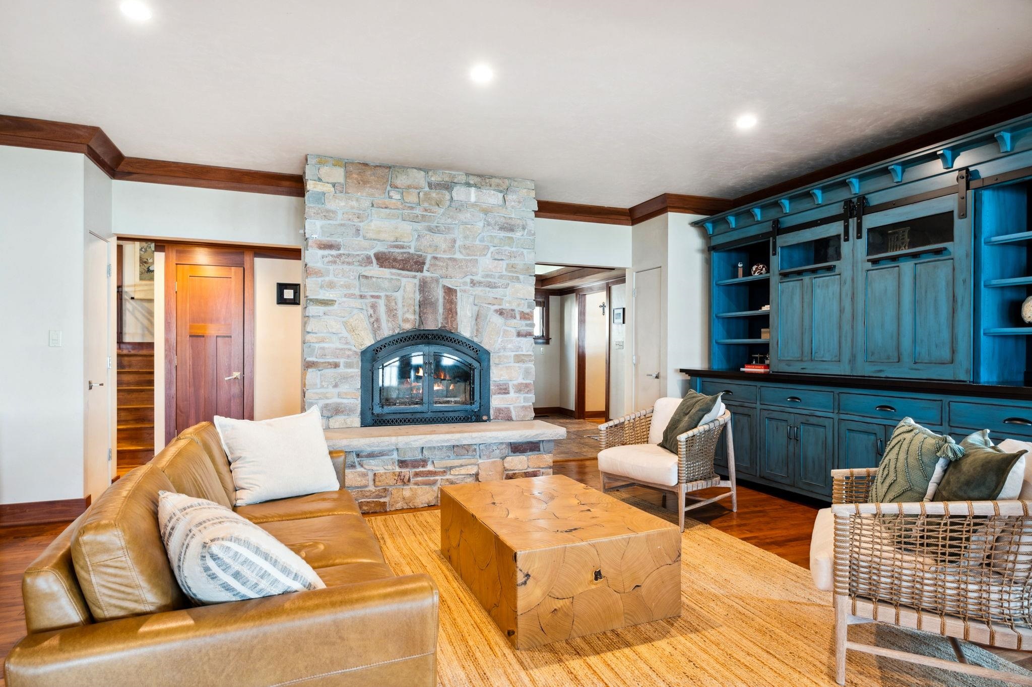 Living Room with wood burning stone fireplace.