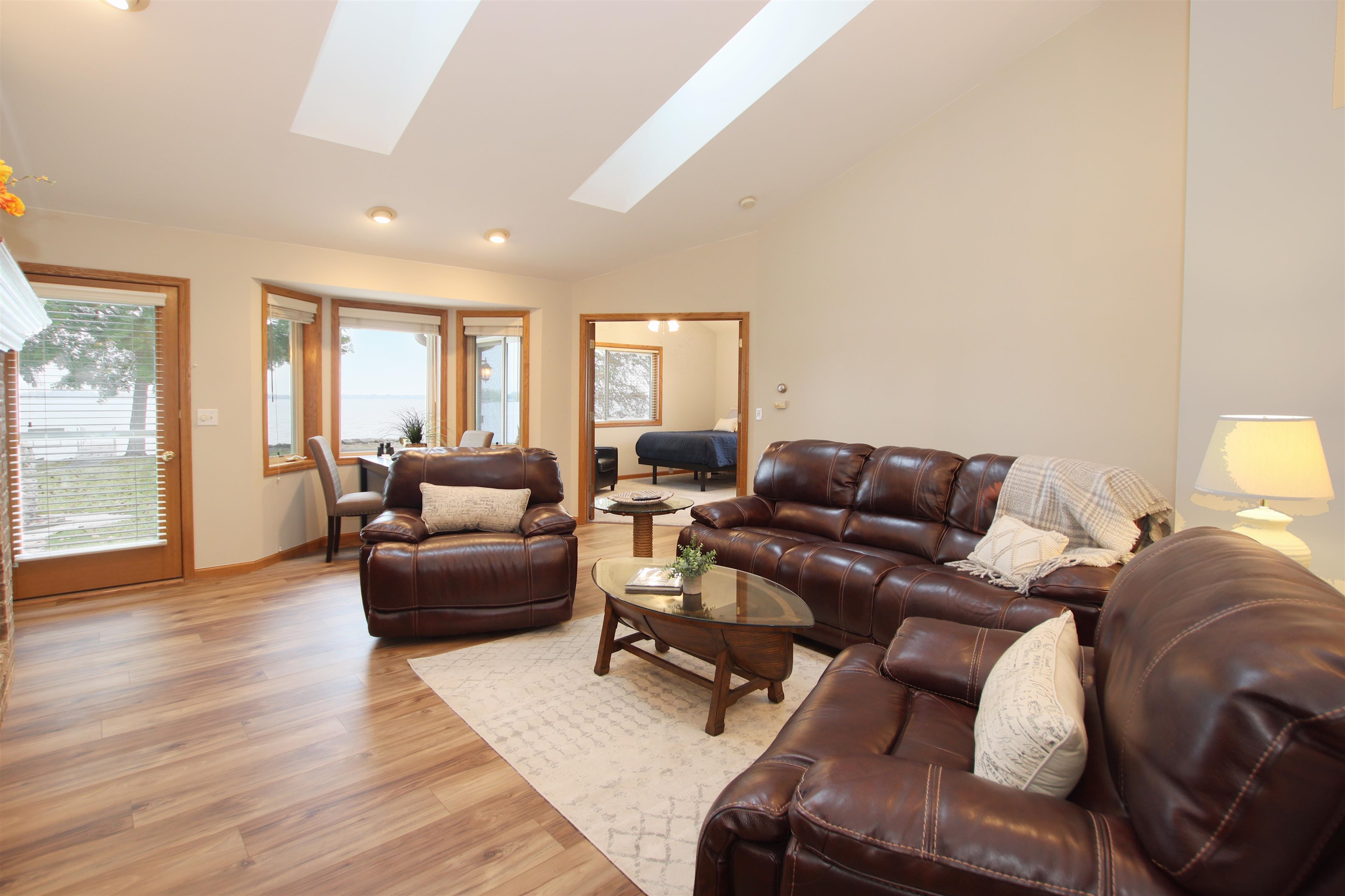 Living Room w Soaring Ceiling and Luxury Vinyl Plank Floors