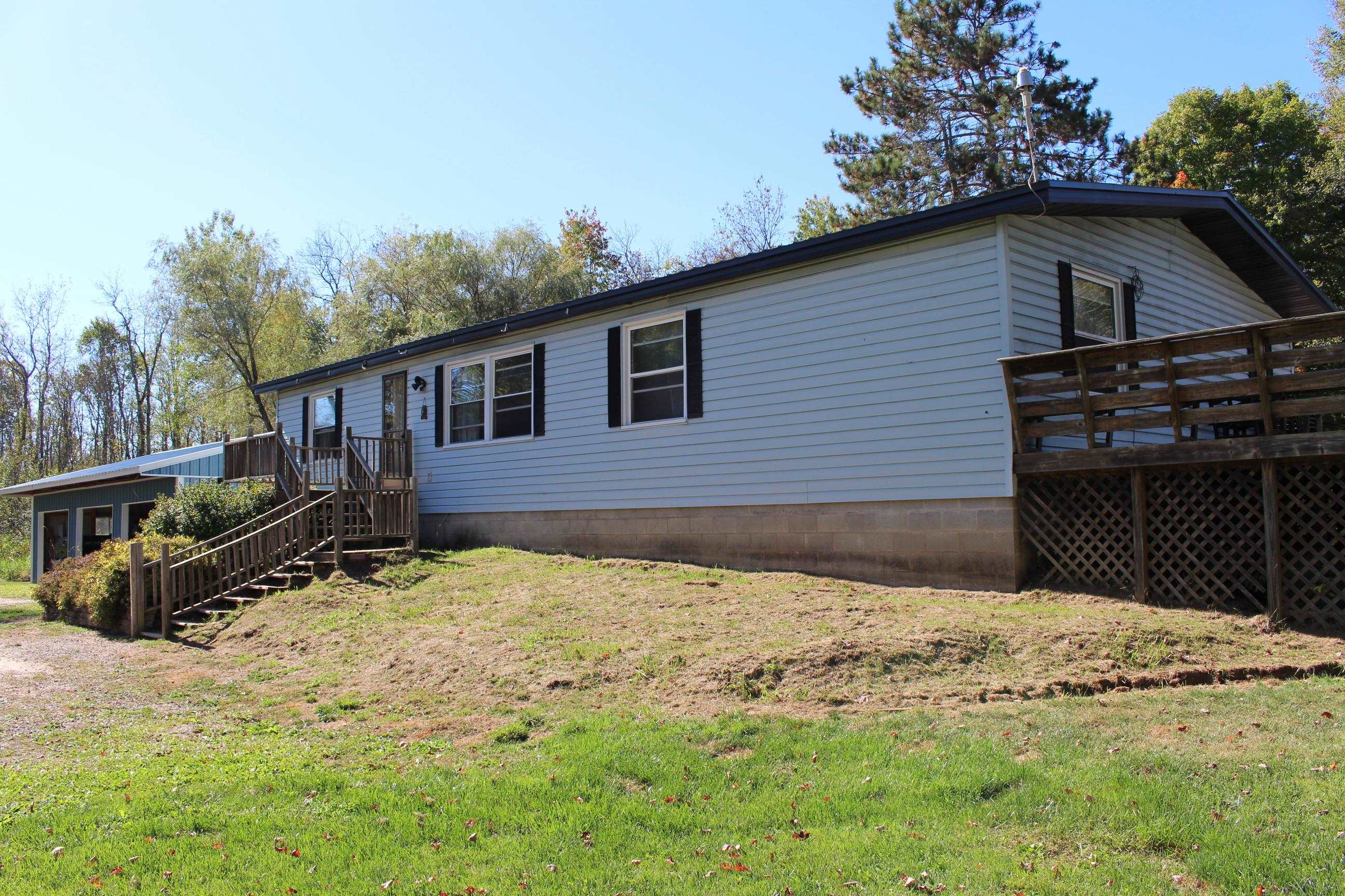 A perfect setting on a block foundation with newer 3 stall garage.