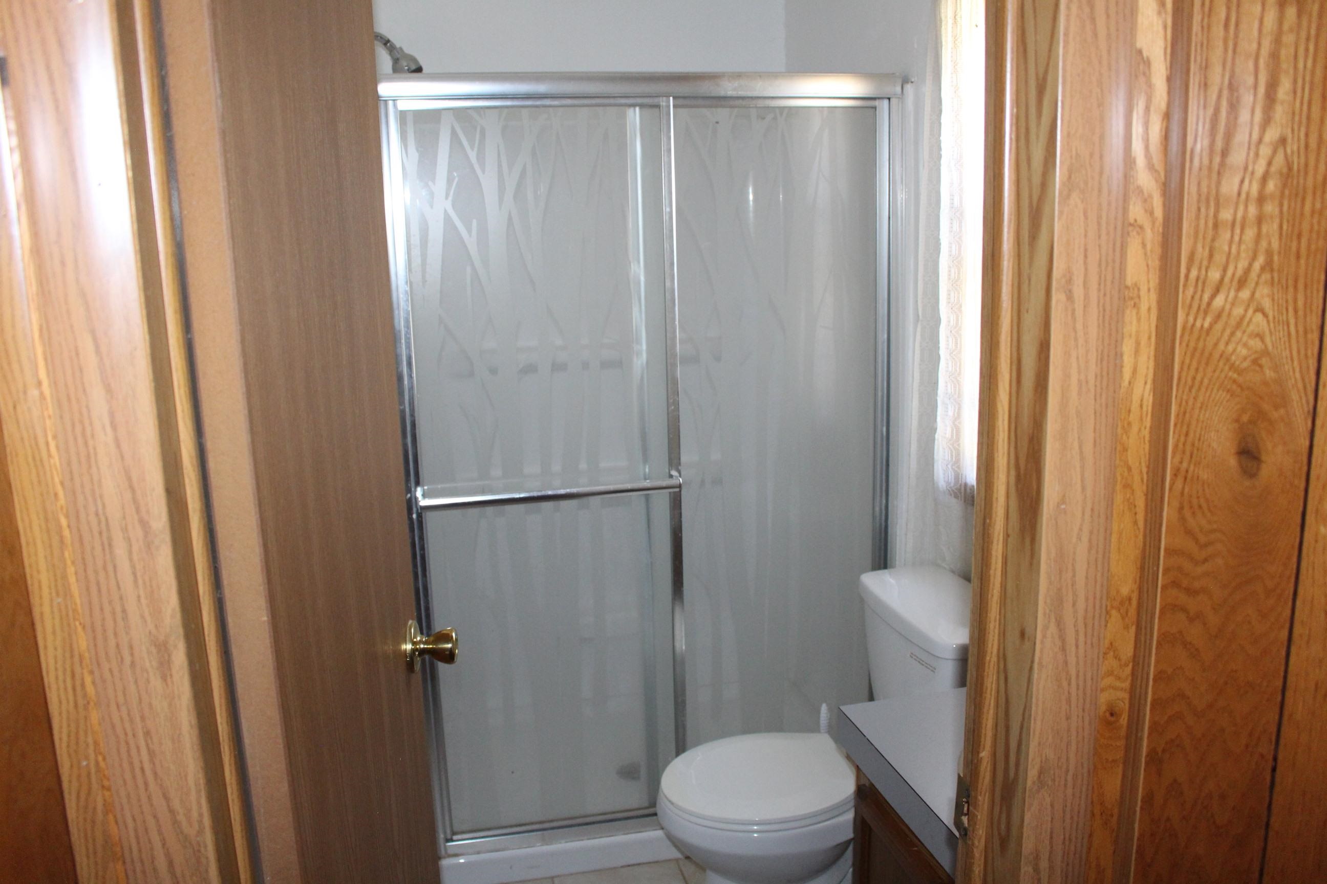 Walk in shower in second bedroom