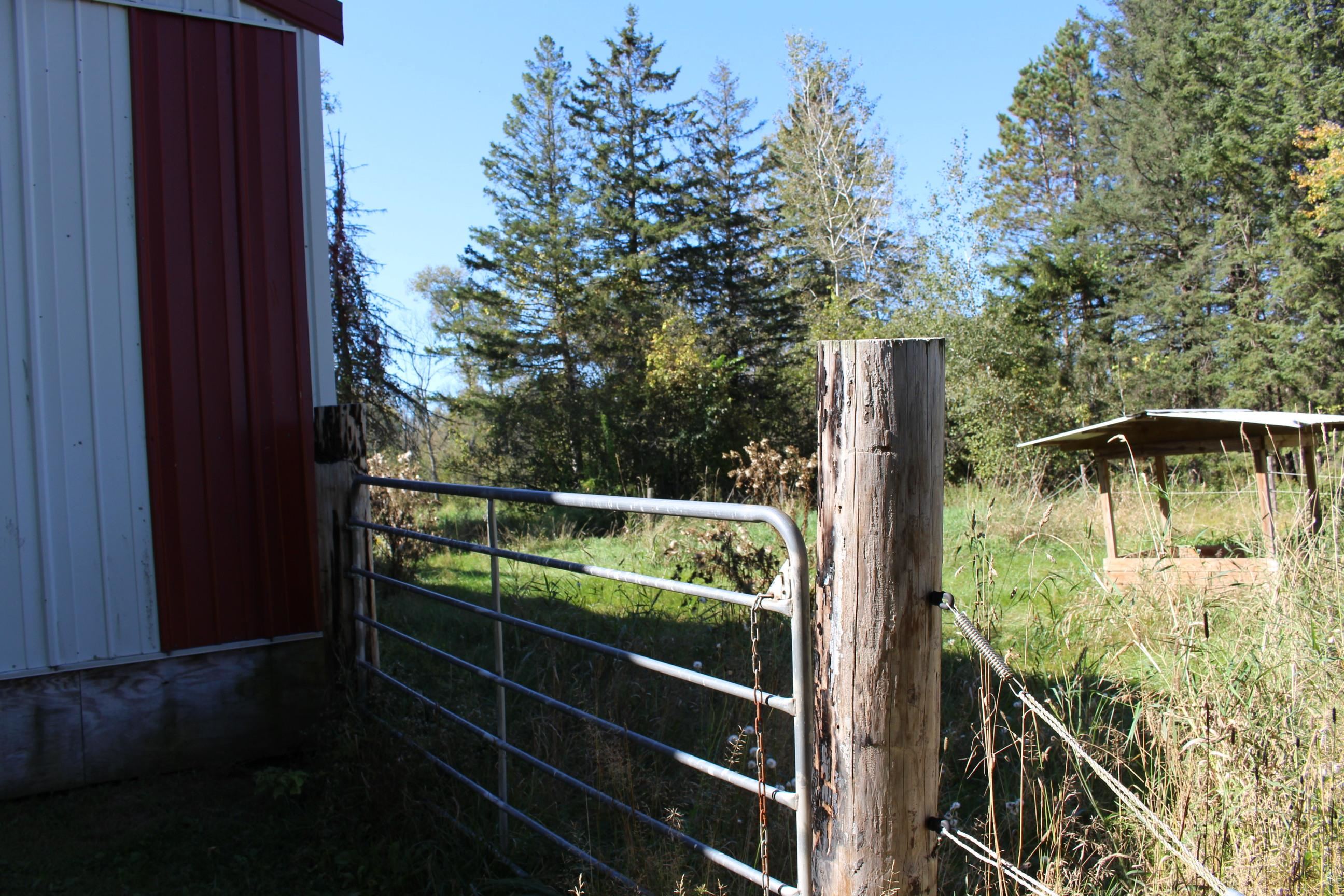 Behind the pole building