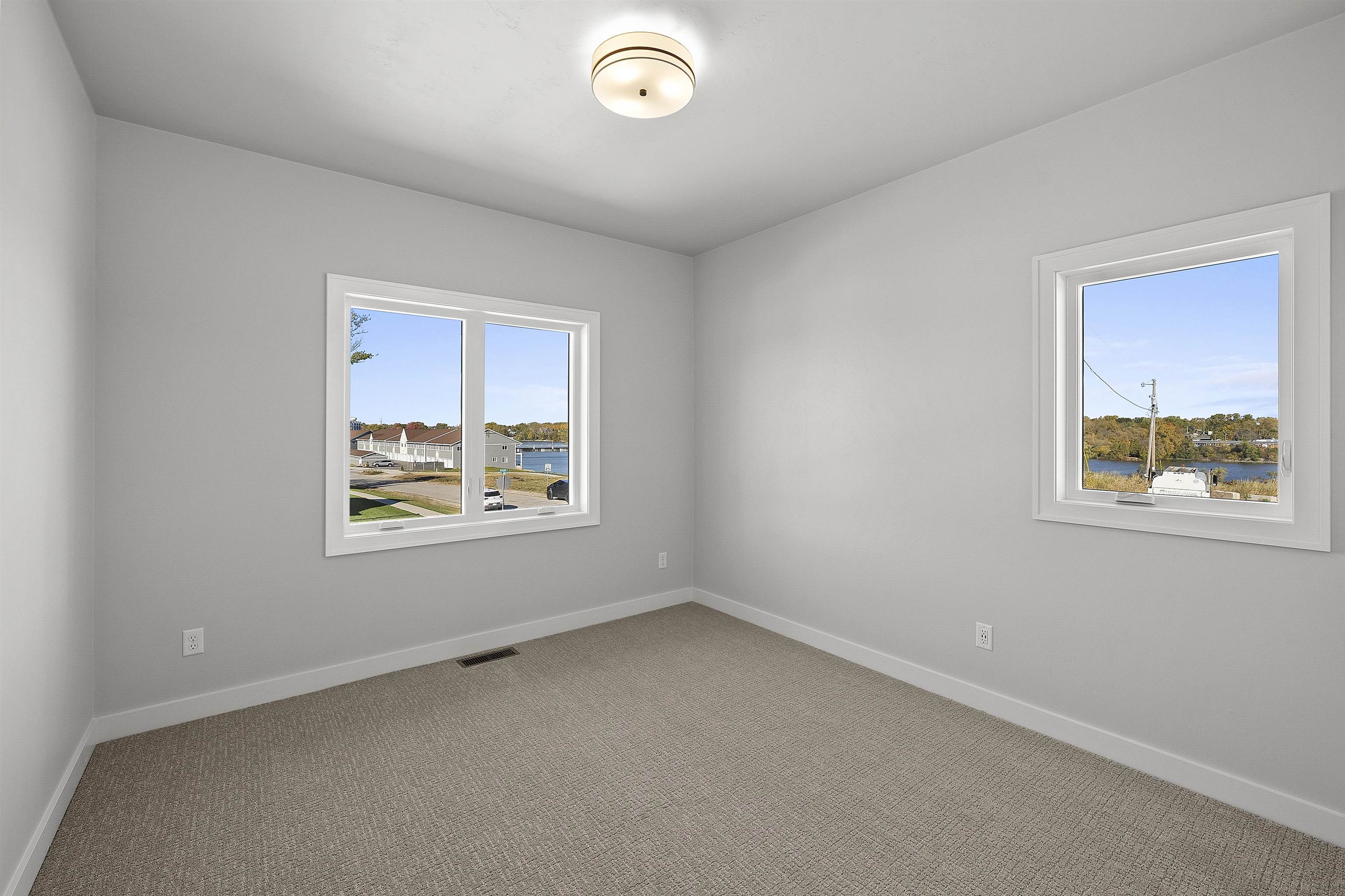 Bedroom with walk-in closet and river views