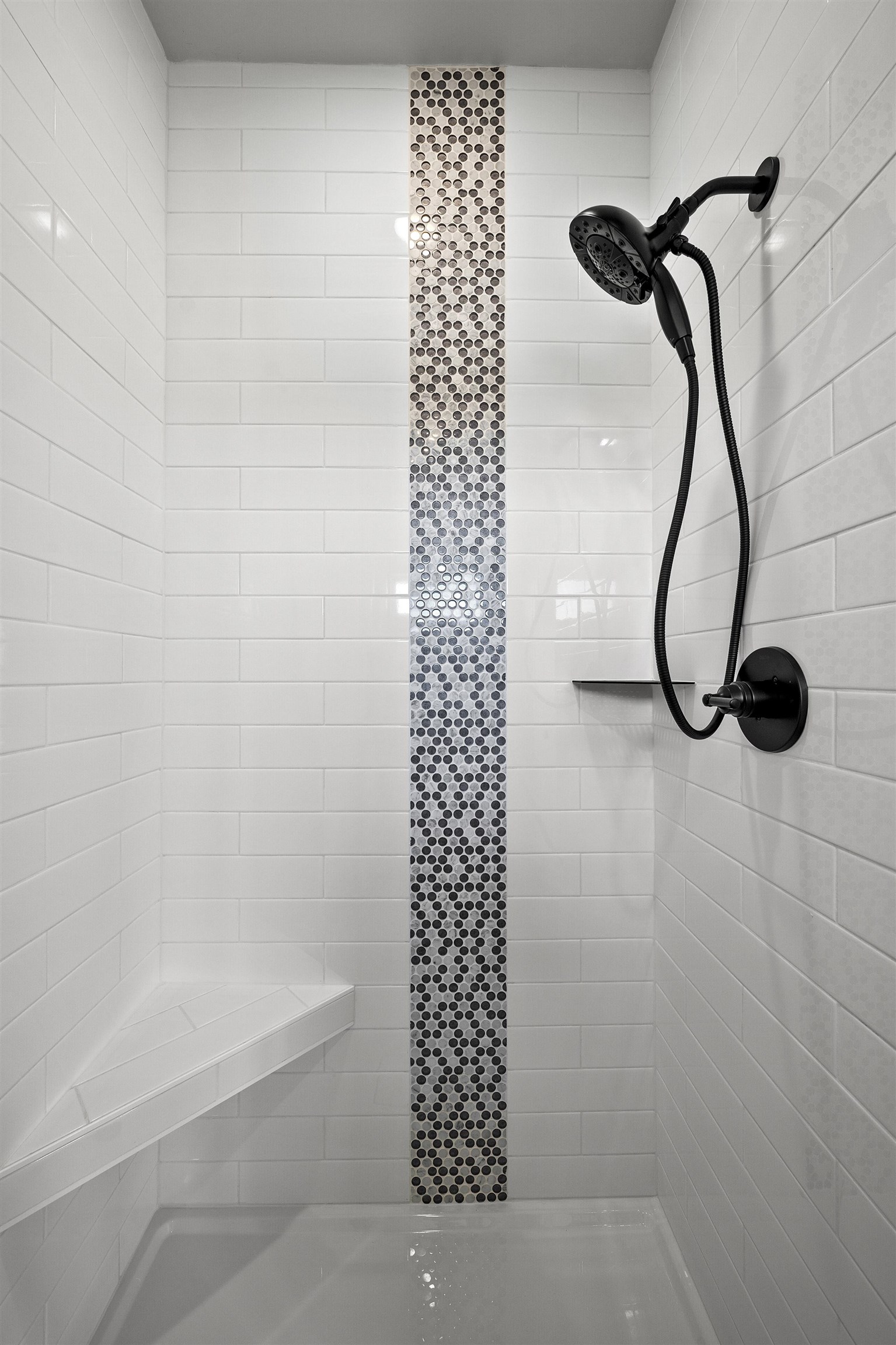 Primary bath's tiled walk-in shower